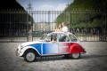 2CV with driver in front of the Luxembourg Garden