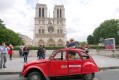 2CV red on a walk in front of Notre Dame de Paris